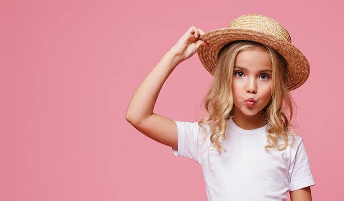 girl in a straw hat with "Here Your Style" ad text on a pink background.
